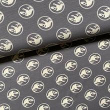 Lade das Bild in den Galerie-Viewer, Baumwolljersey | Jurassic Park Dinosaurier auf Braun