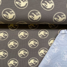 Lade das Bild in den Galerie-Viewer, Baumwolljersey | Jurassic Park Dinosaurier auf Braun